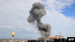 FILE - Smoke billows after an Israeli airstrike on the Rafah refugee camp, in the southern Gaza Strip on October 17, 2023.