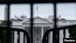 FILE - The White House is seen through a metal gate in Washington, Oct. 6, 2019. 