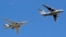 FILE - A Russian IL-78 tanker, right, demonstrating an in-flight refueling of a Tu-160 strategic bomber over Moscow in May 2014, is the type of aircraft that has used the Cam Ranh Bay base.
