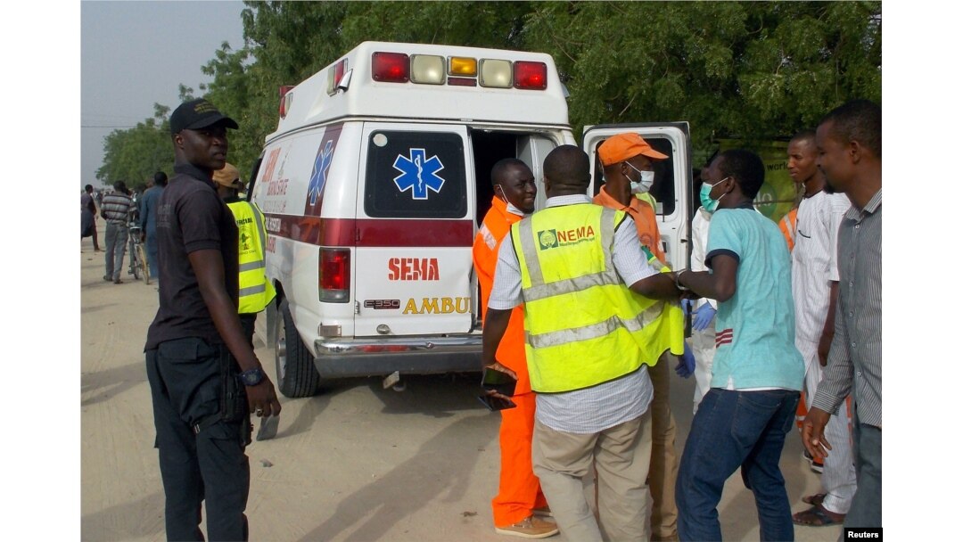 FILE - Rescue workers are seen at the site of an attack by Boko Haram militants in the northeast city of Maiduguri, Nigeria, April 27, 2018.