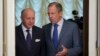 Russian Foreign Minister Sergey Lavrov, right, greets his French counterpart Laurent Fabius prior to their meeting in Moscow, Sept. 17, 2013. 