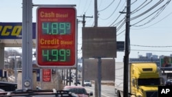 A sign at a gas station on Rte. 1A displays the price of diesel fuel, March 4, 2022, in Boston.