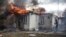 A house is on fire following shelling on the town of Irpin, 26 kilometers west of Kyiv, Ukraine, Friday, March 4, 2022. 
