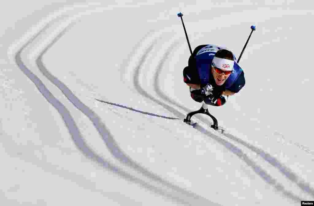 Scott Meenagh of Britain competes in the men&#39;s long distance sitting event at the National Biathlon Center in Zhangjiakou, China during the Beijing 2022 Winter Paralympic Games.