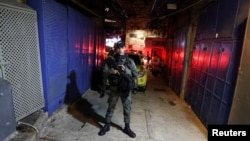 An Israeli Border policeman secures the area following an incident inside Jerusalem's Old City, March 7, 2022.