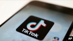 FILE - This Monday, Sept. 28, 2020, file photo, shows the TikTok logo on a smartphone in Tokyo. (AP Photo/Kiichiro Sato, File)