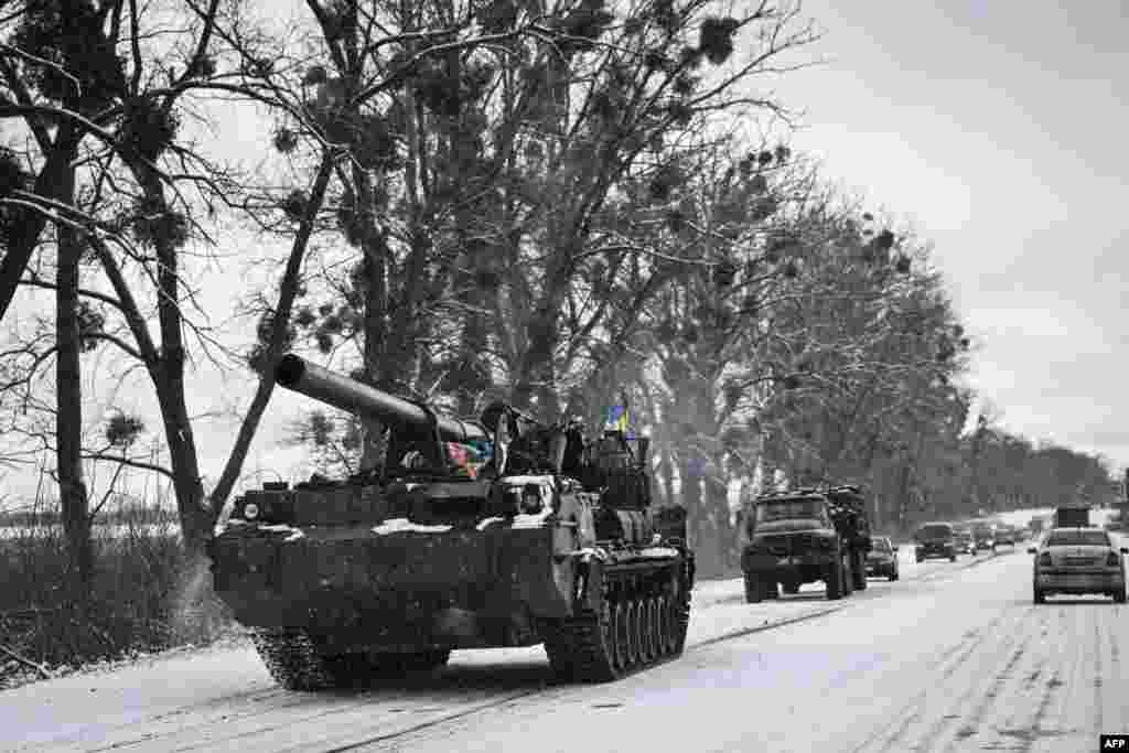A Ukrainian tank rolls along a main road in Ukraine, March 8, 2022.