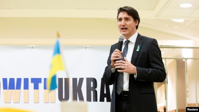 FILE - Canada's Prime Minister Justin Trudeau visits a Ukrainian church to speak with members of the Ukrainian community as Russia's invasion of Ukraine continues, in Toronto, Ontario, March 4, 2022.