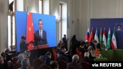 File- Chinese Foreign Minister Wang Yi attends the second meeting of Foreign Ministers of Afghanistan's Neighboring Countries virtually in Tehran, Iran, Oct. 27, 2021.