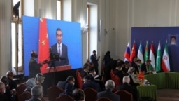 File- Chinese Foreign Minister Wang Yi attends the second meeting of Foreign Ministers of Afghanistan's Neighboring Countries virtually in Tehran, Iran, Oct. 27, 2021.
