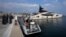 Italian Finance Police stand by the yacht "Lady M," owned by Russian oligarch Alexei Mordashov, docked at Imperia's harbor, Italy, March 5, 2022.