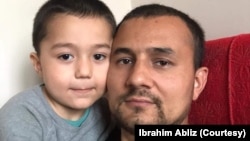 Ibrahim Abliz, a Uyghur refugee in Poland, with his 4-year-old son, in March 2022. (Courtesy of Ibrahim Abliz)