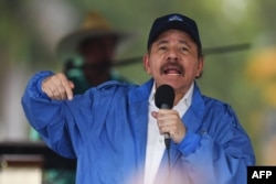 FILE - Nicaraguan President Daniel Ortega speaks to supporters during the government-called "Walk for Security and Peace" in Managua, July 7, 2018.