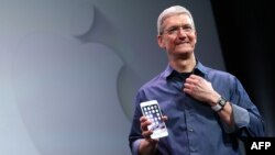 FILE - Apple CEO Tim Cook 