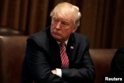 U.S. President Donald Trump meets with immigration crime victims at the White House in Washington, June 28, 2017.