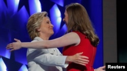 Democratic presidential nominee Hillary Clinton hugs her daughter Chelsea as she arrives to accept the nomination on the fourth and final night at the Democratic National Convention in Philadelphia, Pennsylvania, U.S. July 28, 2016.