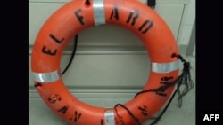 FILE - This still image from video taken on Oct. 4, 2015 by the U.S. Coast Guard shows a life ring recovered by the Coast Guard from the El Faro cargo ship, that went missing during Hurricane Joaquin.