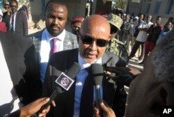 FILE - Opposition candidate Abdirahman Mohamed Abdullahi speaks to the media after casting his vote in the presidential election in Hargeisa, in the semi-autonomous region of Somaliland, in Somalia, Nov. 13, 2017.