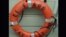 FILE - This still image from video taken on Oct. 4, 2015 by the U.S. Coast Guard shows a life ring recovered by the Coast Guard from the El Faro cargo ship, that went missing during Hurricane Joaquin.