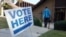 A vote arrives at a polling station at C.T. Martin Natatorium and Recreation Center during the US midterm election, in Tucker, Georgia on November 8, 2022. (AFP)