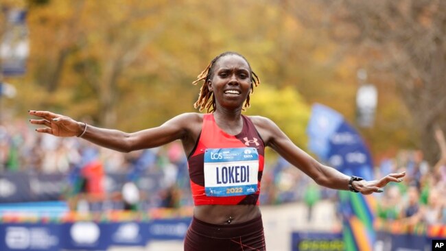 Sharon Lokedi, of Kenya, crosses the finish line first in the women's division of the New York City Marathon, in New York, Nov. 6, 2022.