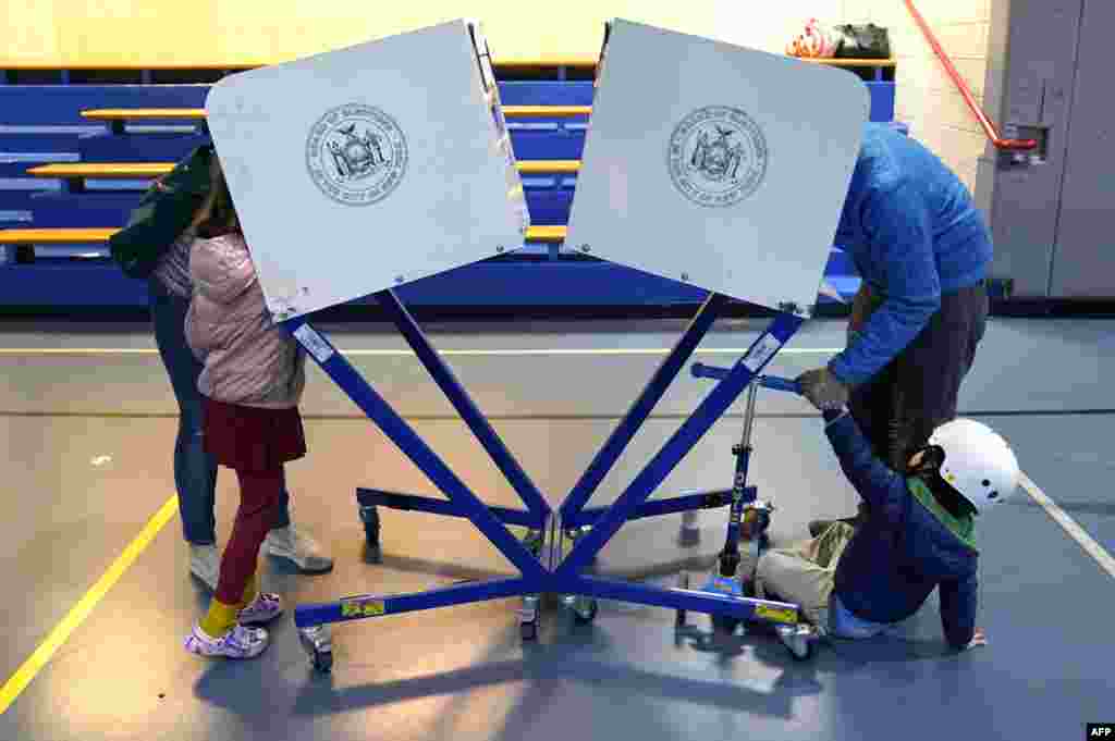 Voters cast ballots in the U.S. midterm elections ,at the Edward A. Reynolds West Side High School in New York City.