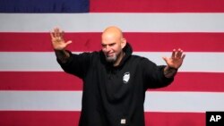FILE - Democrat John Fetterman waves to supporters during an election night party in Pittsburgh, Nov. 9, 2022. The Pennsylvania senator, still recovering from a stroke, has checked himself into a hospital to seek treatment for clinical depression, his office said Thursday.