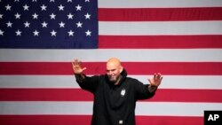 Pennsylvania Lt. Gov. John Fetterman, Democratic candidate for U.S. Senate, waves to supporters after addressing an election night party in Pittsburgh, Nov. 9, 2022.