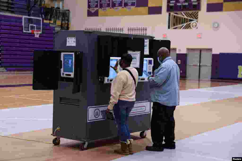 Voters cast their ballots at the Thurgood Marshall High School polling station during the 2022 U.S. midterm election in Dayton, Ohio, Nov. 8, 2022. 