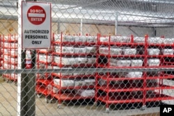 Mail-in and absentee ballots sit in a secure area of the Allegheny County Election Division Elections warehouse in Pittsburgh, Nov. 3, 2022. These ballots will be processed and counted beginning at 7p on Nov. 8, 2022.