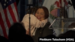 U.S. Sen. Tammy Duckworth hugs her daughter Abigail after giving an election night speech at Adler Planetarium in Chicago, IL, Nov 8, 2022.