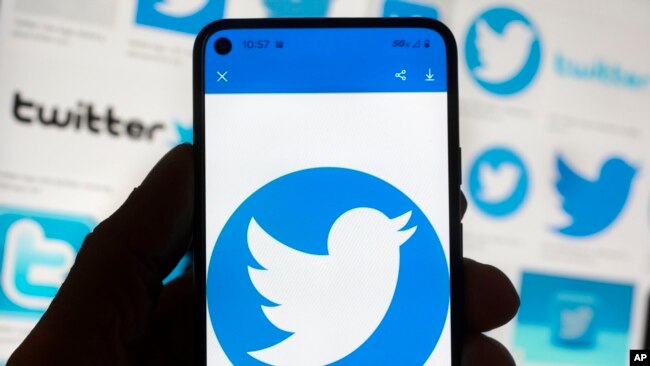 The Twitter logo is seen on a cell phone, Friday, Oct. 14, 2022, in Boston, Massachusetts. (AP Photo/Michael Dwyer)