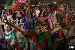 FILE - Supporters of former Pakistan prime minister Imran Khan take part in a protest against the assassination attempt on him, in Lahore, Nov. 5, 2022.