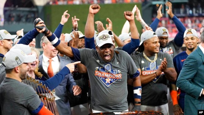 Houston Astros manager Dusty Baker Jr. and the Houston Astros celebrate their 4-1 World Series win against the Philadelphia Phillies in Game 6 on Nov. 5, 2022, in Houston.