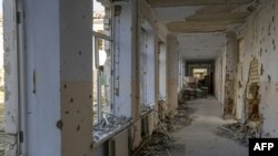 FILE - This photograph shows a school corridor in the Kherson region village of Arkhanhelske on Nov. 3, 2022, which was formerly occupied by Russian forces. Russia’s military announced Nov. 9, 2022, that it’s withdrawing from Kherson and nearby areas.