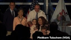 U.S. Sen. Tammy Duckworth embraces her family after giving an election night victory speech at Adler Planetarium on Nov. 8, 2022.