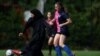 Pemain Sisterhood FC Raya Ahmed menendang bola saat pertandingan turnamen Ladies Super Liga 7-A-side melawan PCWAFC, di lapangan sepak bola Archbishop's Park di London, Inggris, 24 Juli 2022. (REUTERS/Hannah McKay CARI "MCKAY SISTERHOOD FC")