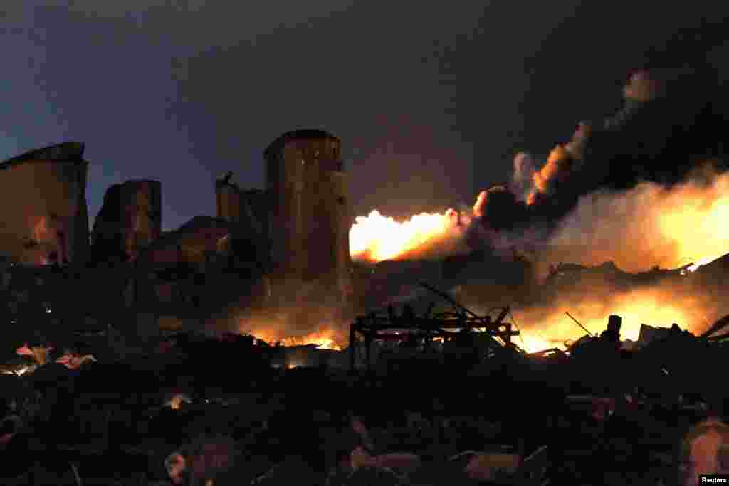 The remains of a fertilizer plant burn after an explosion at the plant in the town of West, near Waco, Texas early April 18, 2013. 