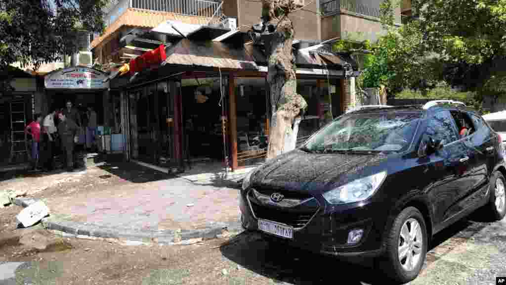 &nbsp;Syrian official news agency (SANA) photo shows a building damaged by what SANA said was a missile in Damascus, Sept. 2, 2013.