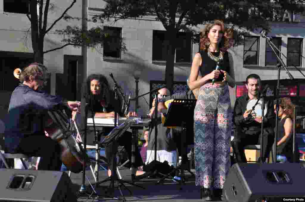 Syrian singer and songwriter Nano Raies, accompanied by her band, performs a number of traditional Syrian folk songs during Syria Fest in Washington, Sept. 3, 2017. (Photo courtesy of Rabah Seba)
