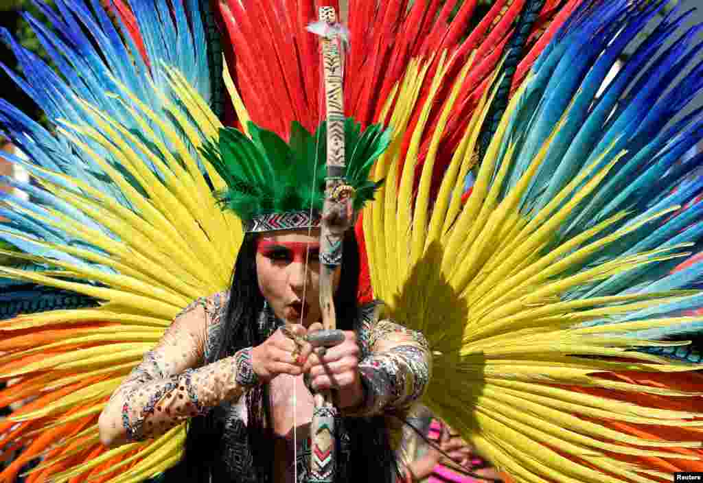 A reveler takes part in the Notting Hill Carnival in London.