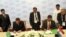 Sahatmurad Mamedov of Turkmengaz, left, and Bhuwan Chandra Tripathi of India's state-owned Gail Ltd., at signing ceremony, Avaza, Turkmenistan, May 23, 2012.