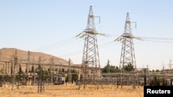 (FILE) A view shows electricity pylons in Kiswah, Damascus suburbs, Syria September 8, 2021.