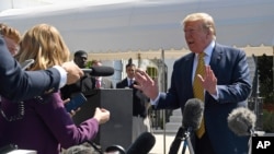 President Donald Trump speaks to reporters on the South Lawn of the White House in Washington, June 22, 2019, before boarding Marine One for the trip to Camp David in Maryland. 