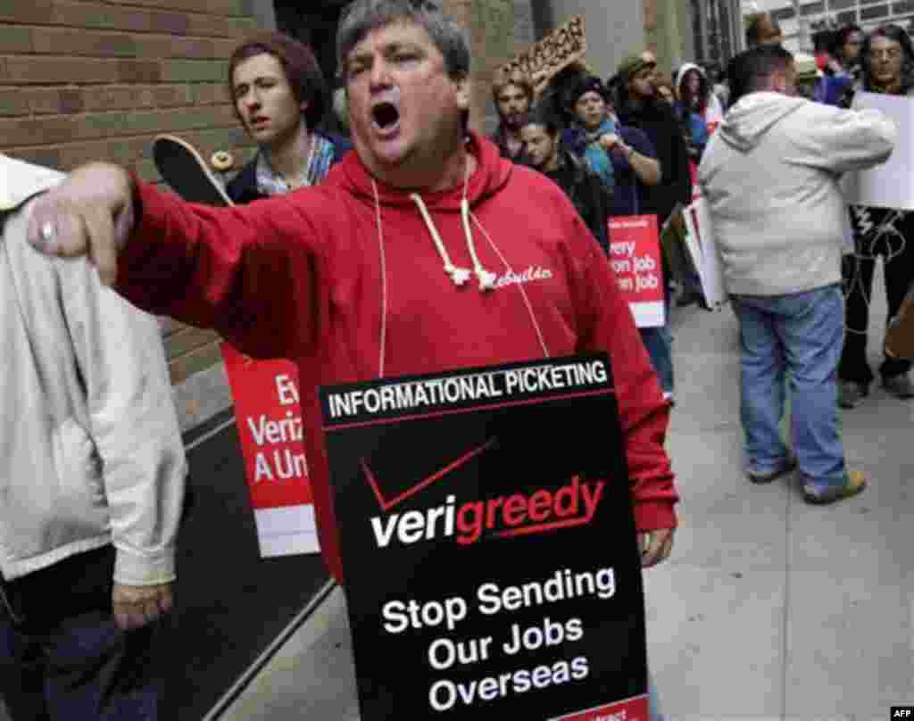 Kevin Condy and other picketing Verizon employees are joined by Occupy Wall Street protesters in front of a Verizon office in New York, Tuesday, Oct. 4, 2011. The protests have gathered momentum and gained participants in recent days as news of mass arres