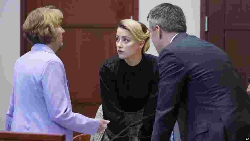 Actress Amber Heard talks to her attorneys in the courtroom at the Fairfax County Circuit Courthouse in Fairfax, Virginia.&nbsp;Actor Johnny Depp sued his ex-wife Amber Heard for libel after she wrote an op-ed piece in The Washington Post in 2018 referring to herself as a &quot;public figure representing domestic abuse.&quot;