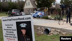 News media crews assemble outside the family home of former U.S. Marine Trevor Reed, who was convicted in 2019 in Russia and released in exchange for Russian pilot Konstantin Yaroshenko, in Granbury, Texas, April 27, 2022. 