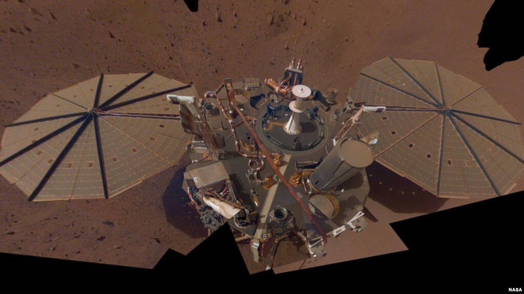 This "selfie" photo of NASA’s InSight lander is made up of 14 images taken on March 15 and April 11, 2021 – the 106th and 133rd Martian days, or sols, of the mission – by the spacecraft Instrument Deployment Camera located on its robotic arm. (Image Credits: NASA/JPL-Caltech)