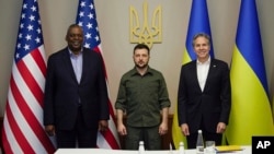 In this image from video provided by the Ukrainian Presidential Press Office and posted on Facebook, on Monday, April 25, 2022, from left; U.S. Secretary of Defense Lloyd Austin, Ukrainian President Volodymyr Zelenskyy and U.S. Secretary of State Antony Blinken.