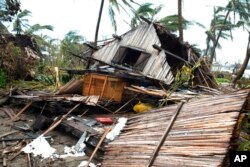 FILE - A house lays in ruins after Cyclone Batsirai in Mananjary, Madagascar, Feb. 10, 2022.